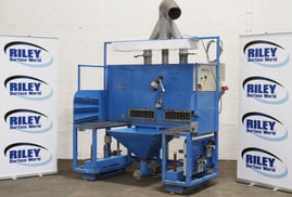 Powered Adjustable Height Fettling Bench with Lighting and Dust Extraction.